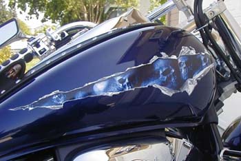 Motorcycle Tank with Ripped Torn Metal Blue Skull Graphic Installed.  Looks as good as an airbrush paint job!